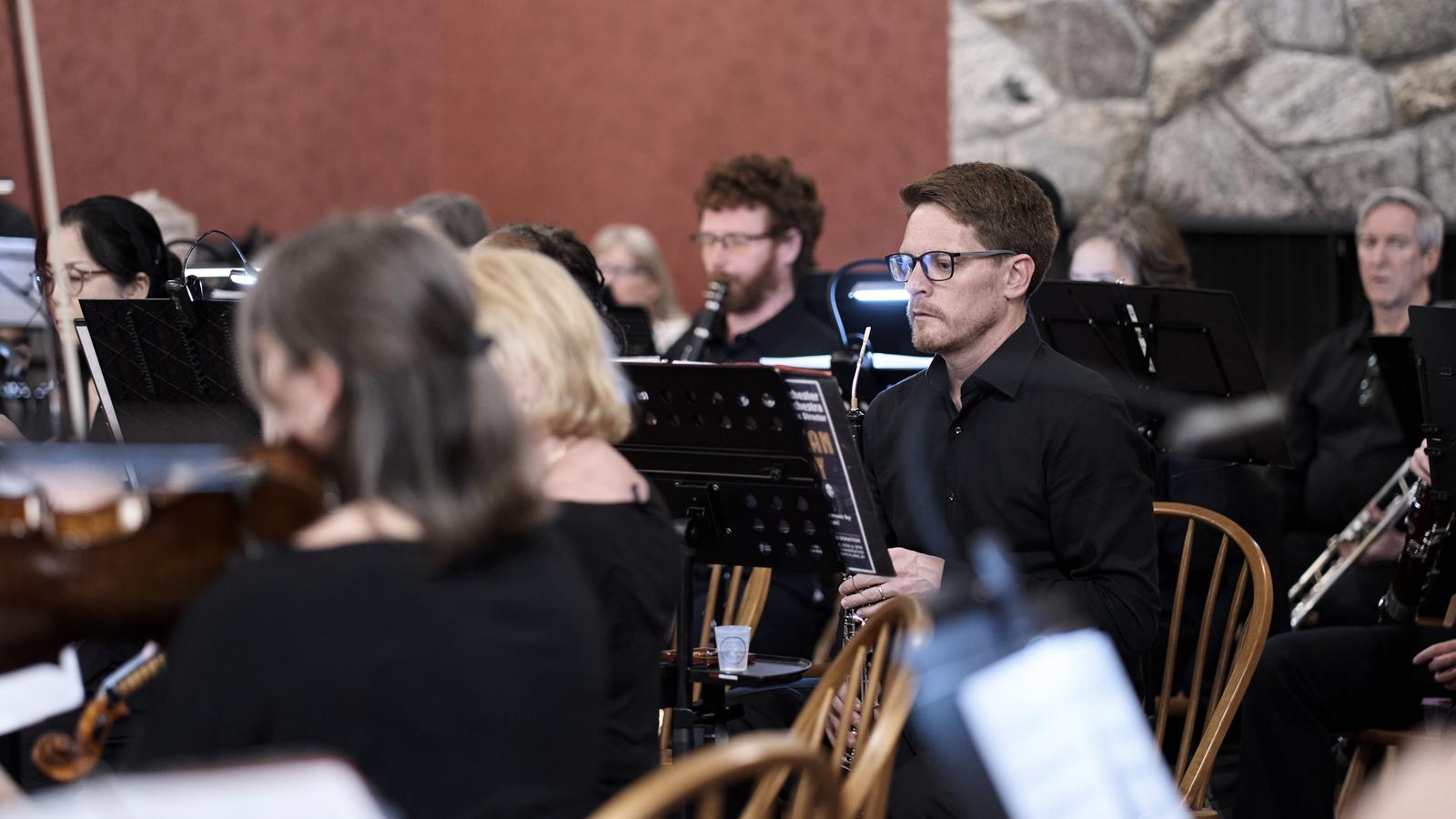 The wind section of the orchestra during a performance
